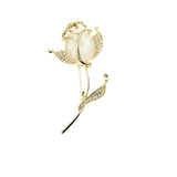golden rose brooch