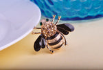 Small bee brooch with green eyes
