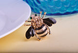 Small bee brooch with green eyes