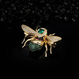 Shimmering Silver Bee Brooch on Black Background
